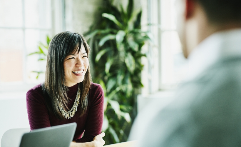 Financial professional woman speaking with a man