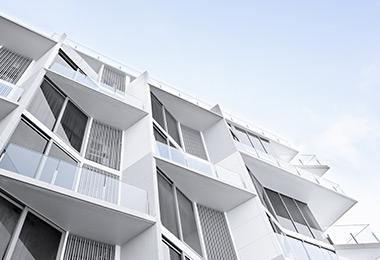 Facade of a white building with balconies