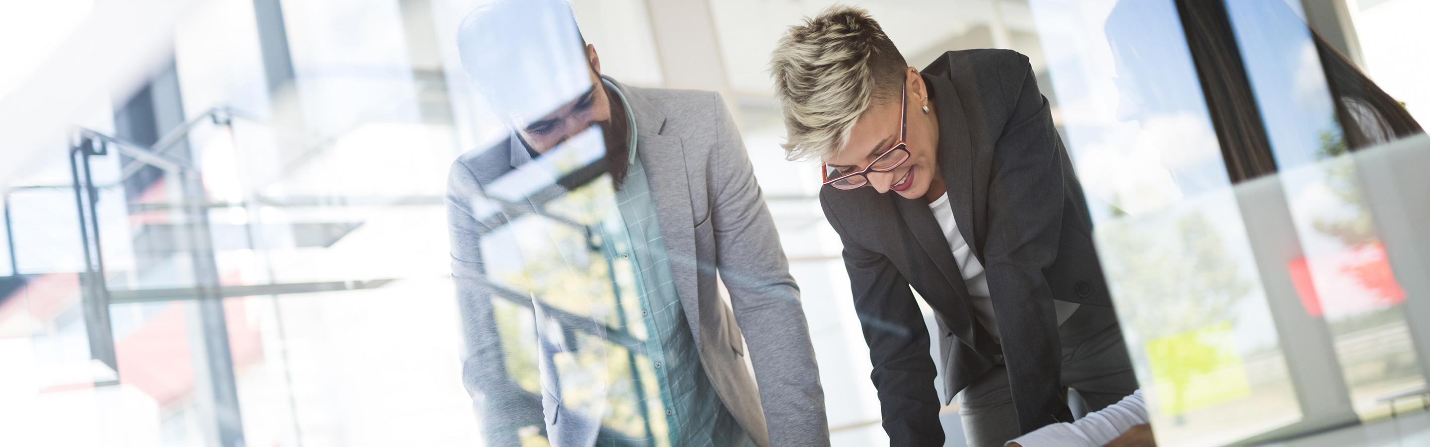 Looking in through glass at a business meeting