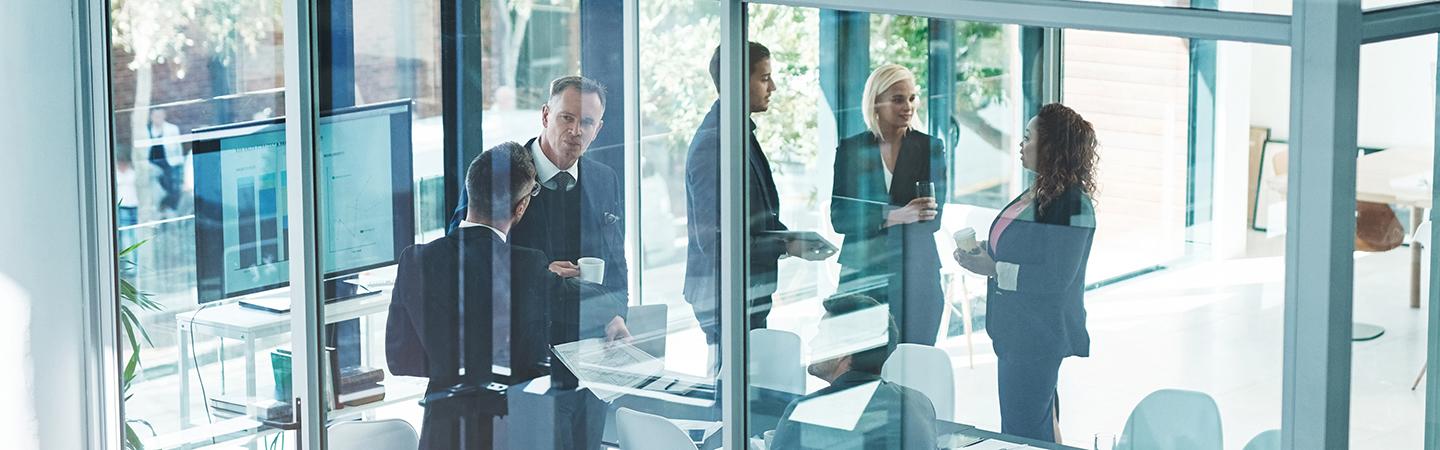 Financial professionals meeting in a conference room